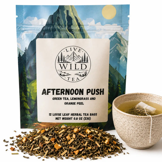 Live Wild Tea Afternoon Push green tea with lemongrass and orange peel beside a cup of brewed tea.