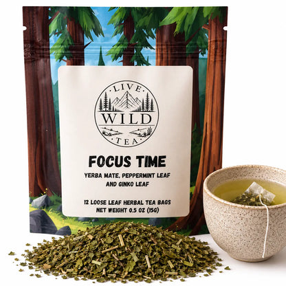 Live Wild Tea Focus Time herbal focus tea with yerba mate, peppermint and ginkgo beside a cup of brewed tea.