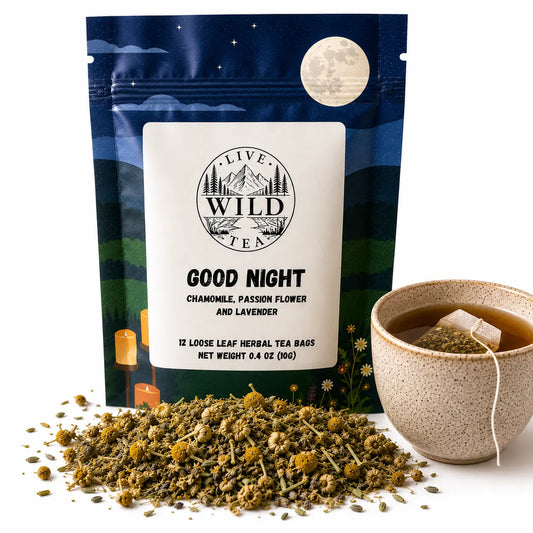 Live Wild Tea Good Night herbal sleep tea with chamomile, lavender and passionflower in a stand-up pouch beside a cup of brewed tea.